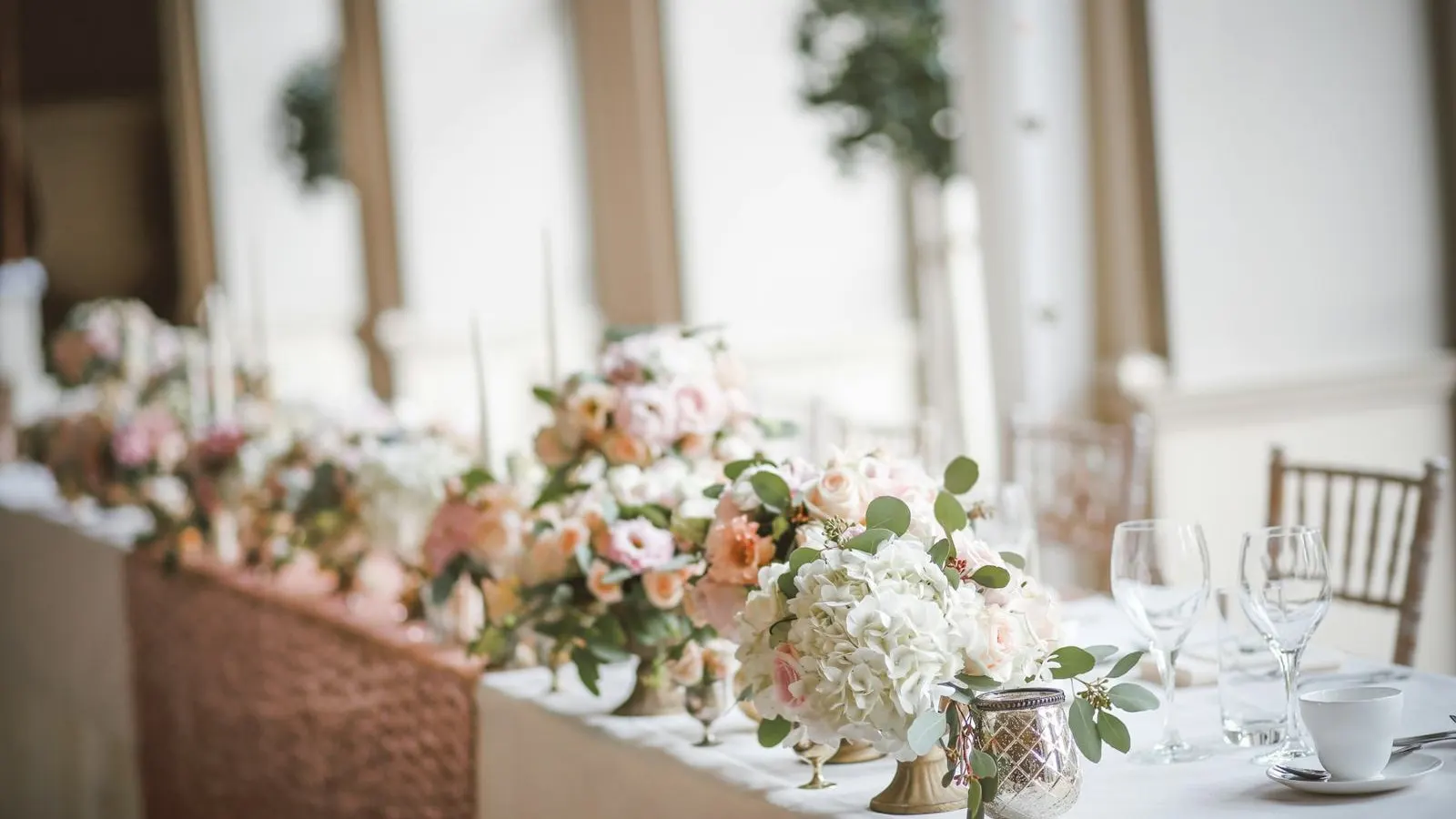 Top table decorated with pink and white flowers